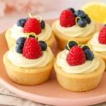 Berry lemon cheesecake cookie cups on pink plate with berries