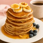 cottage cheese banana pancakes on plate with syrup
