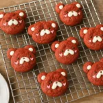 red velvet bear cookies on cooling rack